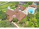 Aerial view of the community clubhouse and swimming pool at 13009 Wedgewood Way # 63-D, Hudson, FL 34667