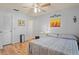 Comfortable bedroom with wood floors, neutral walls, and ceiling fan at 13009 Wedgewood Way # 63-D, Hudson, FL 34667