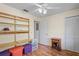 Versatile bedroom featuring wood floors, built-in shelving, and closet space, perfect for storage and organization at 13009 Wedgewood Way # 63-D, Hudson, FL 34667