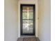 Close-up of the front door, providing a secure entrance and curb appeal to welcome residents and guests alike at 13009 Wedgewood Way # 63-D, Hudson, FL 34667