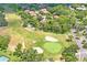 Amazing aerial view of the lush green golf course with a sand trap and mature trees at 13009 Wedgewood Way # 63-D, Hudson, FL 34667