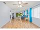 Bright living room with a sliding glass door to a patio allowing lots of natural light to flood the area at 13009 Wedgewood Way # 63-D, Hudson, FL 34667