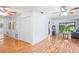 Spacious living room features laminated floors, large windows, ceiling fans and a sliding glass door to a patio at 13009 Wedgewood Way # 63-D, Hudson, FL 34667