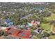 Breathtaking aerial view of the community featuring tennis courts, clubhouse, and golf course at 13009 Wedgewood Way # 63-D, Hudson, FL 34667