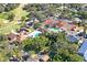 Amazing aerial view of the community featuring the tennis courts, clubhouse, and pool at 13009 Wedgewood Way # 63-D, Hudson, FL 34667