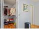 Walk-in closet with organized shelving, clothing racks, and wood flooring, offering ample storage space at 13009 Wedgewood Way # 63-D, Hudson, FL 34667
