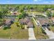 Aerial view of a single-Gathering home with lush landscaping and a long driveway at 13491 Coronado Dr, Spring Hill, FL 34609