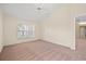 Spacious bedroom features neutral paint, high ceiling, plush carpet, and a ceiling fan at 13491 Coronado Dr, Spring Hill, FL 34609