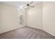 Large neutral bedroom featuring a ceiling fan, carpet, and a large window at 13491 Coronado Dr, Spring Hill, FL 34609