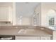 Kitchen sink and countertop featuring modern appliances with a view into the breakfast nook at 13491 Coronado Dr, Spring Hill, FL 34609