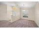 Spacious room featuring neutral walls and carpets, complemented by a large window at 13491 Coronado Dr, Spring Hill, FL 34609