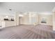Spacious living room with a breakfast bar overlooking the kitchen and a large front window at 13491 Coronado Dr, Spring Hill, FL 34609