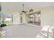 Enclosed patio featuring tile floor and screens, offering a seamless transition to the outdoors at 13491 Coronado Dr, Spring Hill, FL 34609