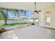 Enclosed patio featuring tile floor and screens, offering a seamless transition to the outdoors at 13491 Coronado Dr, Spring Hill, FL 34609