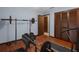 Home exercise room with wood floors and exercise equipment at 1376 Fayetteville Dr, Spring Hill, FL 34609