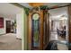 Elegant foyer featuring a grandfather clock and views into the dining and living spaces at 1376 Fayetteville Dr, Spring Hill, FL 34609