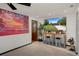 Living room featuring a large television displaying the home's exterior at 1376 Fayetteville Dr, Spring Hill, FL 34609
