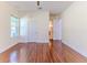 Spacious bedroom features hardwood floors and ample natural light from a window at 13772 Dunwoody Dr, Spring Hill, FL 34609