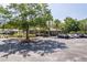 Community clubhouse exterior featuring accessible parking spaces and lush landscaping at 13772 Dunwoody Dr, Spring Hill, FL 34609