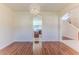 Open dining room with an archway showcasing kitchen and staircase at 13772 Dunwoody Dr, Spring Hill, FL 34609