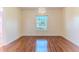 Charming dining room featuring hardwood floors and a decorative chandelier at 13772 Dunwoody Dr, Spring Hill, FL 34609