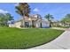 Two story home displaying a green lawn, 2-car garage and neutral color, highlighting curb appeal at 13772 Dunwoody Dr, Spring Hill, FL 34609
