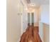 Hallway with wood flooring and neutral-toned walls, enhanced by recessed lighting at 13772 Dunwoody Dr, Spring Hill, FL 34609