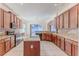 Well-appointed kitchen featuring granite countertops, stainless appliances, and a center island at 13772 Dunwoody Dr, Spring Hill, FL 34609