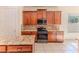 Modern kitchen features a stylish island, oven, and tiled backsplash at 13772 Dunwoody Dr, Spring Hill, FL 34609