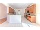 Large open kitchen features granite counters, stainless steel appliances, and tiled floors at 13772 Dunwoody Dr, Spring Hill, FL 34609