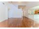 Open-concept living room with wood floors and a view of the kitchen at 13772 Dunwoody Dr, Spring Hill, FL 34609