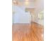 Open-concept living room with wood floors and a view of the kitchen at 13772 Dunwoody Dr, Spring Hill, FL 34609