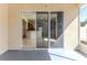 View of kitchen through sliding glass doors to a cozy outdoor patio perfect for relaxing and entertaining at 13772 Dunwoody Dr, Spring Hill, FL 34609