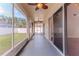 Screened-in patio with ceiling fans, providing a relaxing outdoor living space at 13772 Dunwoody Dr, Spring Hill, FL 34609