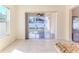 Sunroom features tile floors and sliding glass doors to the backyard at 13772 Dunwoody Dr, Spring Hill, FL 34609