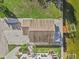 Birds eye view of the property showing the roof, dock, and surrounding landscape at 13821 Judy Ave, Hudson, FL 34667