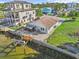 Aerial view showcasing a waterfront home with a private dock and outdoor space at 13821 Judy Ave, Hudson, FL 34667