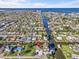 Expansive aerial view of a waterfront community, highlighting canal access, boat docks and close proximity to the ocean at 13821 Judy Ave, Hudson, FL 34667