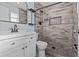 Tastefully renovated bathroom boasts a modern vanity and a walk-in shower with designer tile at 13821 Judy Ave, Hudson, FL 34667