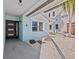 Inviting entryway featuring a stylish front door, modern lighting, and updated landscaping at 13821 Judy Ave, Hudson, FL 34667