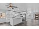 Modern kitchen with an island, stainless steel appliances, and white cabinetry at 13821 Judy Ave, Hudson, FL 34667