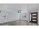 Bright living room with gray flooring, ceiling fan, and lots of natural light at 13821 Judy Ave, Hudson, FL 34667