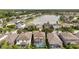 Community aerial view featuring a lake and homes with screened-in pools at 1410 Halapa Way, Trinity, FL 34655