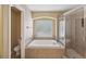 Relaxing bathroom with soaking tub, separate shower, and light tan ceramic tile at 1410 Halapa Way, Trinity, FL 34655