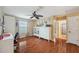 Comfortable bedroom with a ceiling fan and large window for natural light at 1410 Halapa Way, Trinity, FL 34655