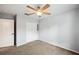 The bedroom is painted a calming light gray with a double door closet and ceiling fan at 1410 Halapa Way, Trinity, FL 34655