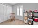 Comfortable bedroom with carpet floors, shutters, a closet, and practical shelf-box storage at 1410 Halapa Way, Trinity, FL 34655