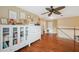 Spacious bedroom with hardwood floors, ample closet space, and a ceiling fan at 1410 Halapa Way, Trinity, FL 34655