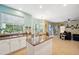 Bright kitchen with breakfast nook and stainless steel appliances, open to the spacious living area at 1410 Halapa Way, Trinity, FL 34655