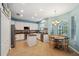 Bright kitchen with white cabinets, stainless steel appliances, a center island, and an adjacent dining area at 1410 Halapa Way, Trinity, FL 34655